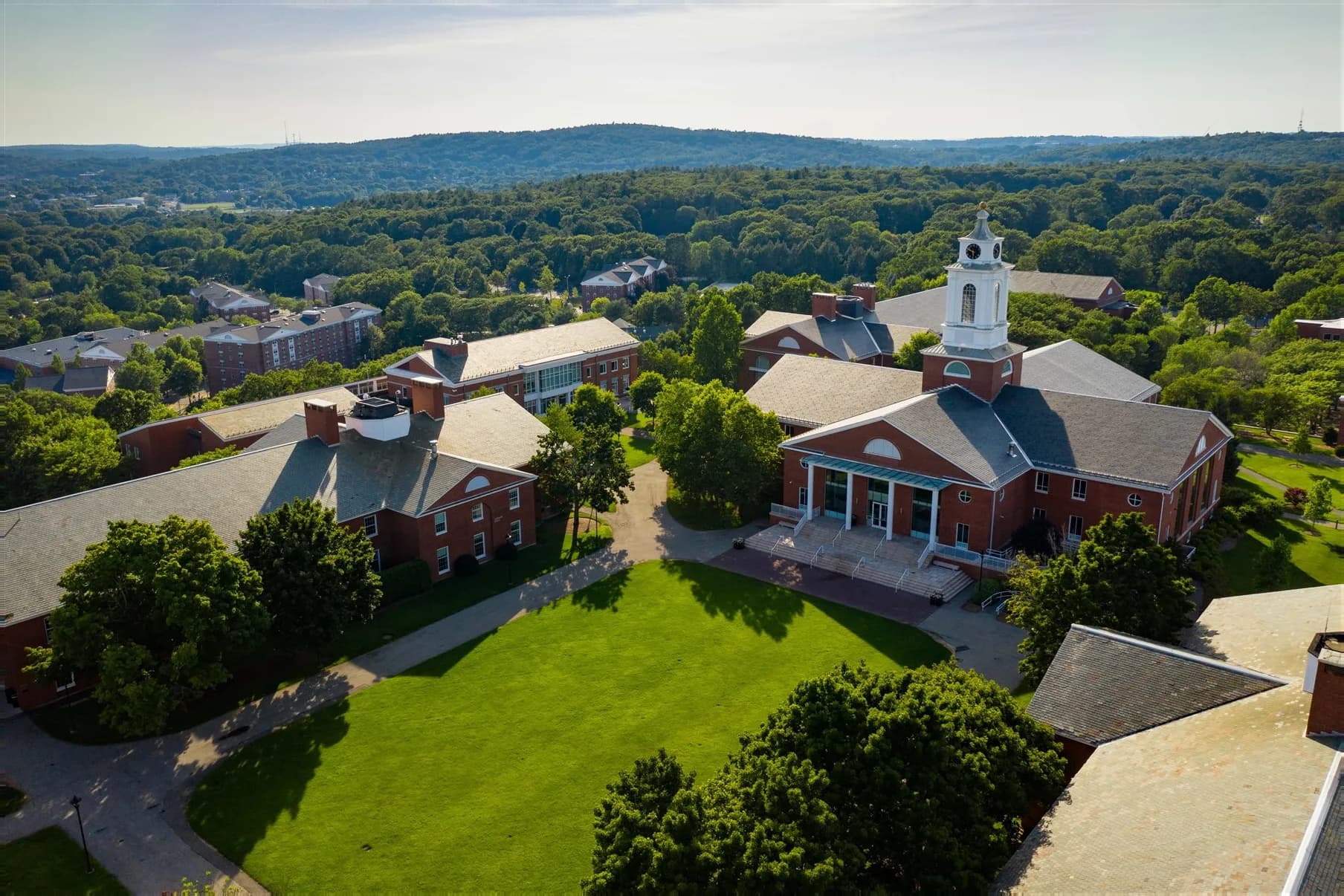 Aerial view of the Bentley University campus surrounded by green areas