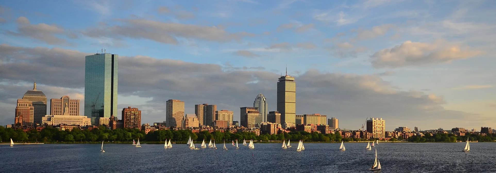 Boston skyline seen from the Charles River, with sailboats on the water